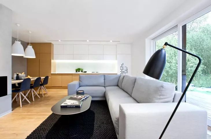 living room, in the foreground the standing lamp Gubi designed by Greta Grossman