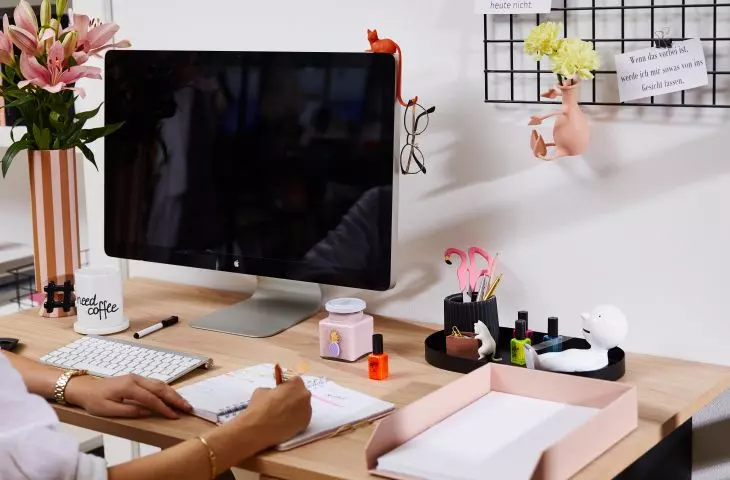 Creative work surrounded by designer objects