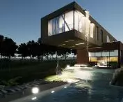 House with waterfall at night