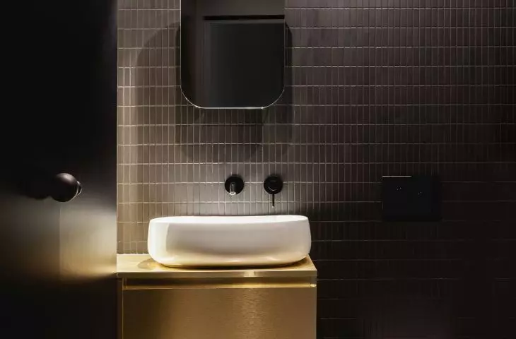 Bathroom with gold cabinet