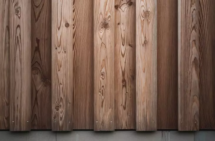 Wood on the facade and sandstone