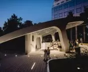 angled concrete ring unifies the block