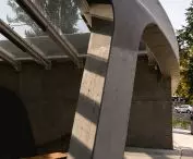 The canopy is supported by a massive reinforced concrete wall