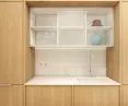 kitchen sink in an alcove between cabinets