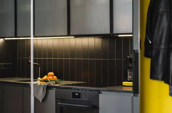 kitchens are optically enlarged by large mirrored cabinets