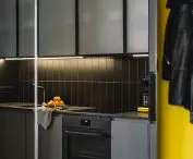 kitchens are optically enlarged by large mirrored cabinets