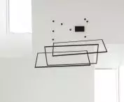 the high living room is illuminated by roof windows