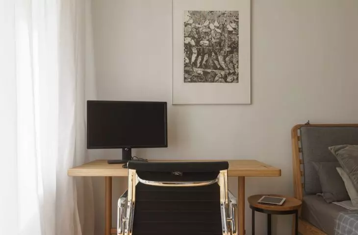 Black leather swivel chair designed by Charles and Ray Eames, prod: Vitra