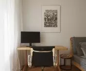 Black leather swivel chair designed by Charles and Ray Eames, prod: Vitra