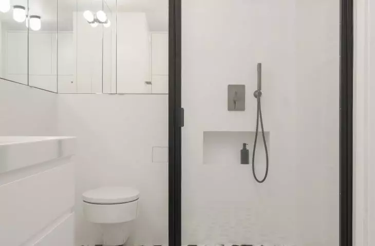 a steel shower stall and steel ventilation grilles were also designed and constructed for the project