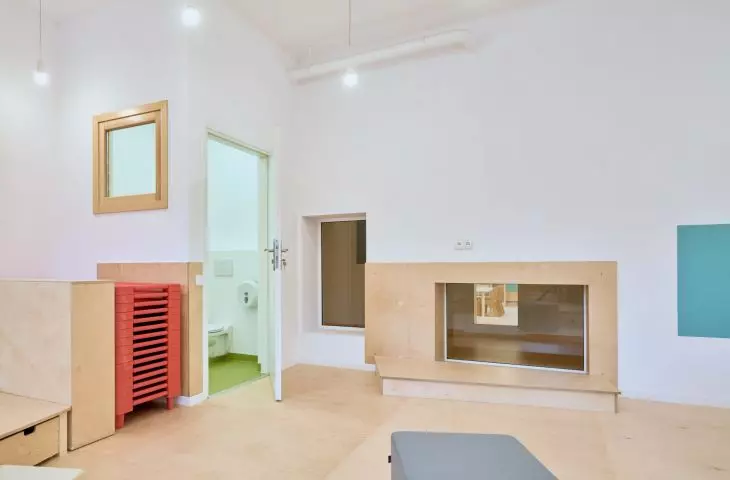 The openings that light up the corridors also serve as seats