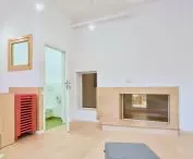 The openings that light up the corridors also serve as seats