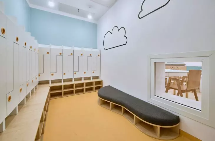 Checkroom with a window allowing children to see into the room