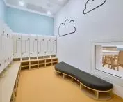 Checkroom with a window allowing children to see into the room