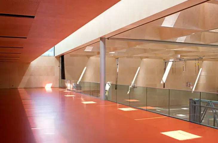 the various parts of the school are connected to each other via glazed footbridges lit from above