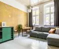 Green cubicle in M1 apartment complements yellowish decorative wall