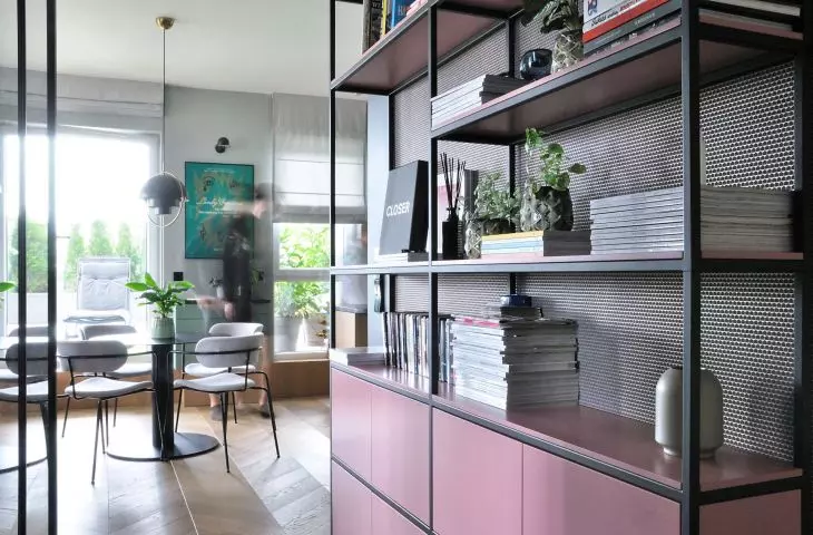 pink bookcase in the hallway