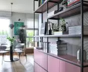 pink bookcase in the hallway