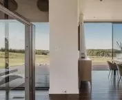 Large windows and a view of the lake