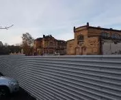 Old Slaughterhouse - southern part, view from behind the temporary fence on Pea Meadows Street.