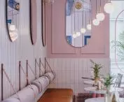 oval mirrors optically enlarge the cafe space