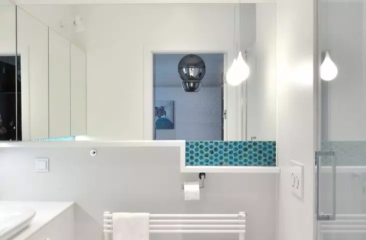 White bathroom with blue accents