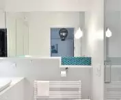 White bathroom with blue accents
