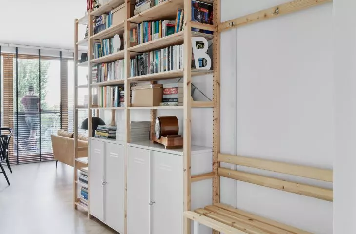Architect designed a library in the hallway