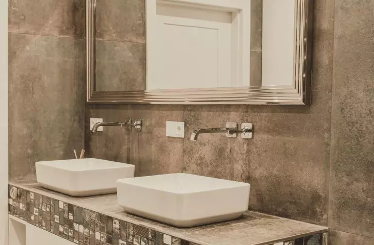 The bathroom is dominated by gray tones