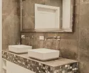 The bathroom is dominated by gray tones