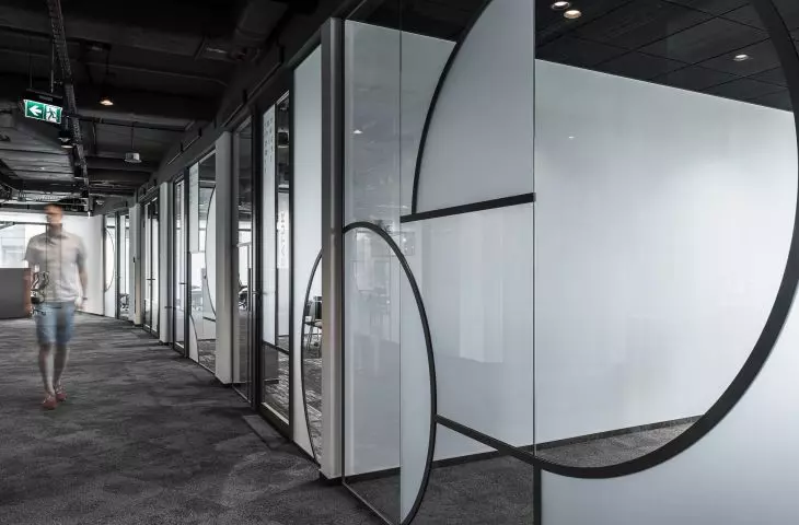 LOFT style office - glass partition wall with asymmetrical circles