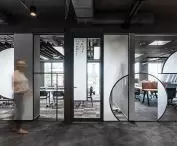 LOFT style office - glass partition wall with asymmetrical circles