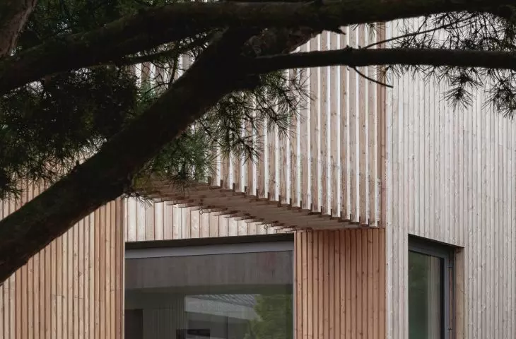 Large glazing and wood on the facade