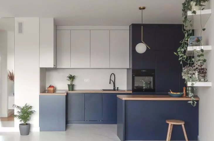 Kitchen in navy blue and gray colors