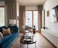 The interior of the apartment on the one hand is austere and minimalist, and on the other - colorful, ornate and eclectic
