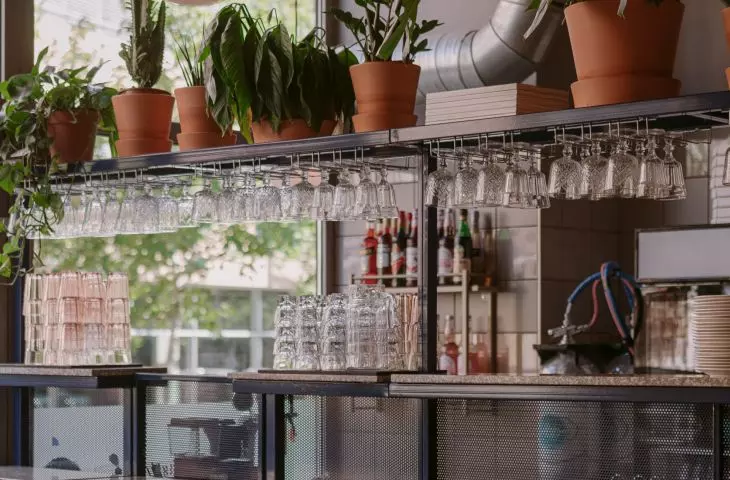 Along the bar, seating for guests of the establishment has also been designed