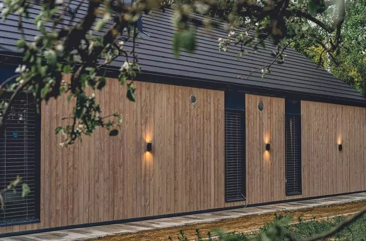 Brick barn in Swidnik, larch on facade