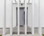 Vertical forms obscure the entrance