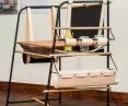 The desk is made of wood, steel and leather