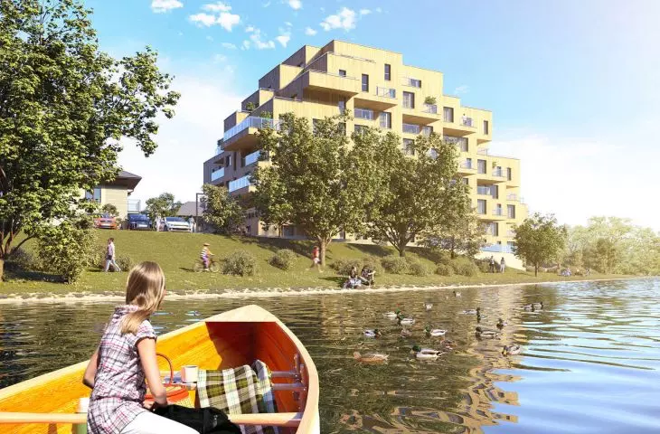 view of the Wooden House from the side of the lagoon