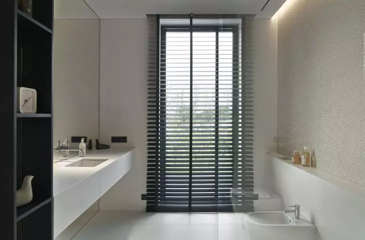 Bathroom kept in white and black