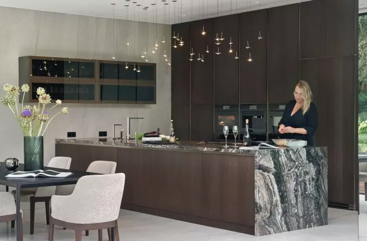 Kitchen island and above it designer lighting