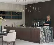 Kitchen island and above it designer lighting