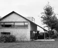 The house is characterized by a large, sloping roof