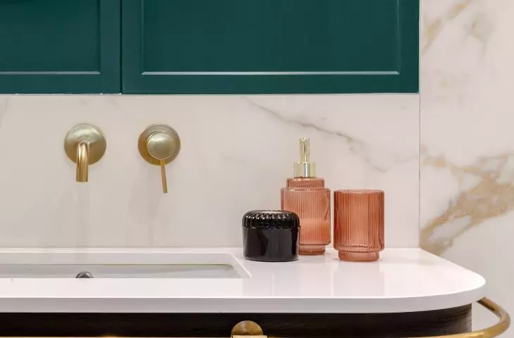 Bathroom with gold railing 
