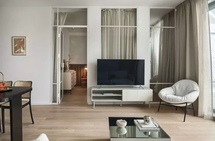 Behind the glazing is a bedroom