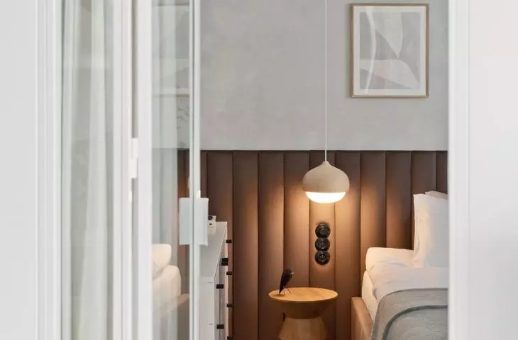 A fragment of the bedroom visible from the living room