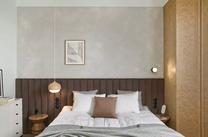Bedroom with quilted bed headboard
