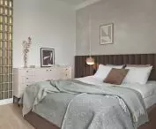The bedroom space is occupied by a large bed