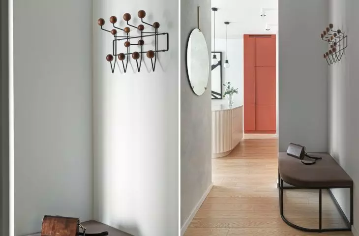 Minimalist hallway leads to kitchen